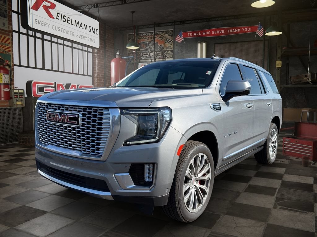 2023 GMC Yukon Denali in Sterling Metallic — front three-quarter view