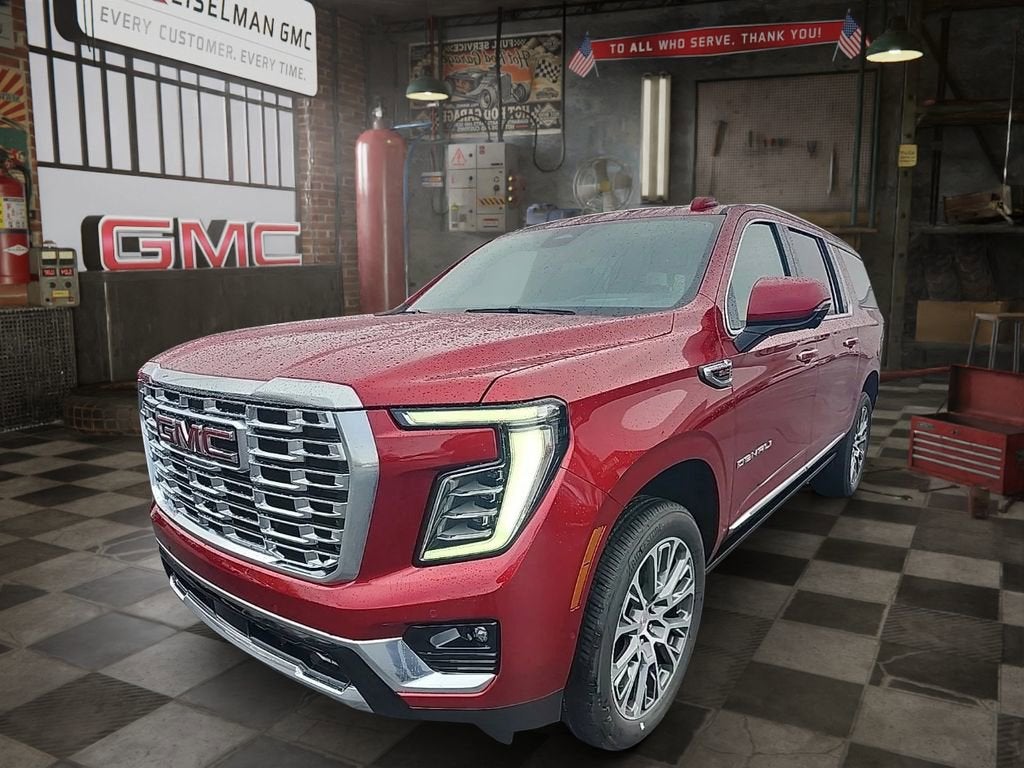2026 GMC Yukon XL Denali in Volcanic Red Tintcoat — front three-quarter view