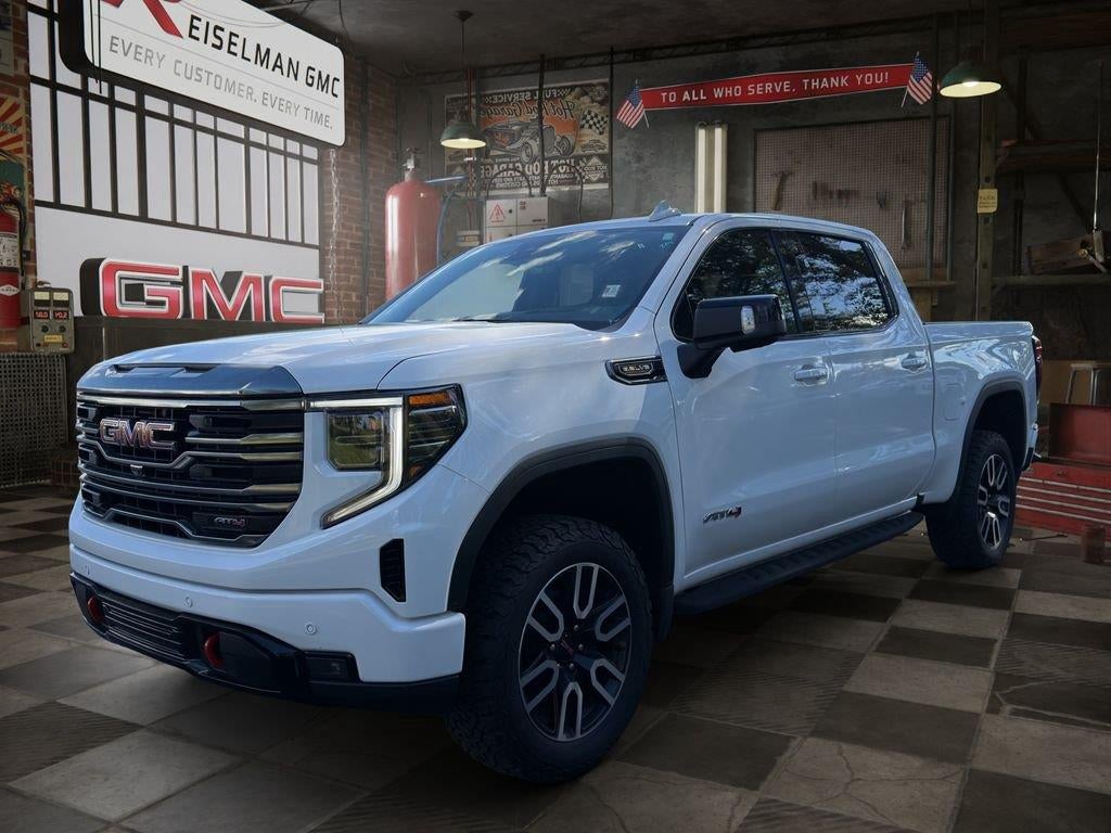 2022 GMC Sierra 1500 AT4 in Summit White — front three-quarter view