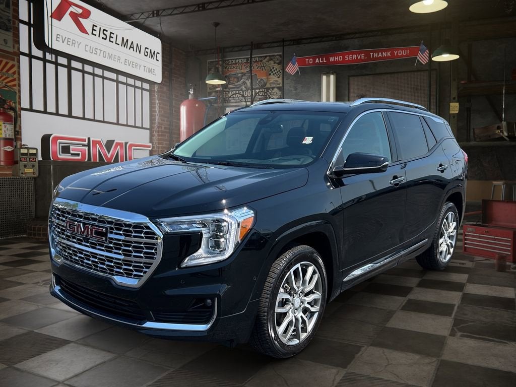 2024 GMC Terrain Denali in Ebony Twilight Metallic — front three-quarter view