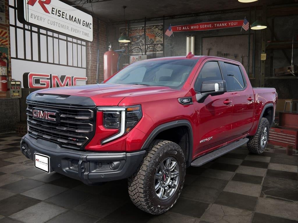 2026 GMC Sierra 1500 AT4X in Volcanic Red Tintcoat — front three-quarter view
