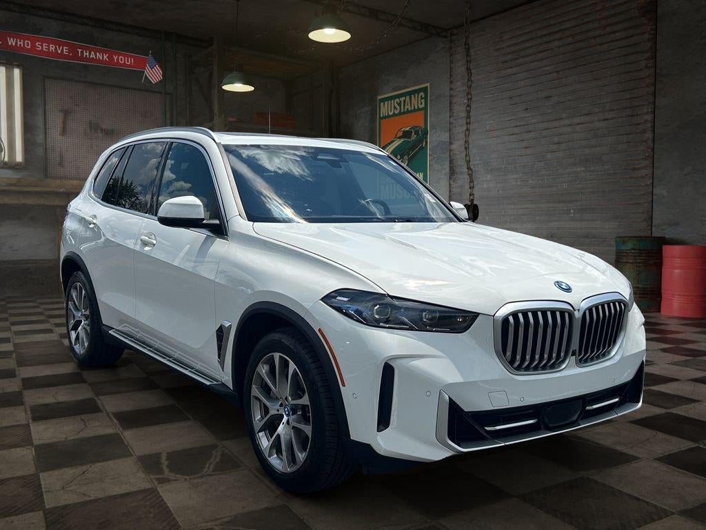 2025 BMW X5 xDrive50e in White — front three-quarter view
