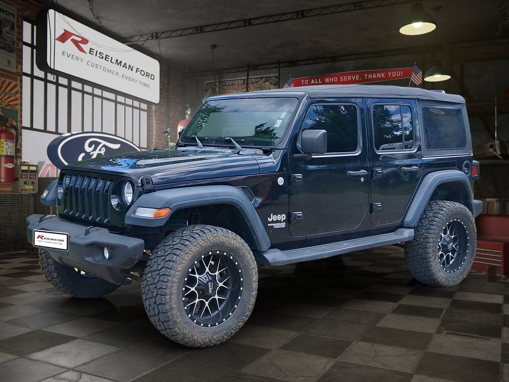 2018 Jeep Wrangler Unlimited Sport S in Black Clearcoat — front three-quarter view